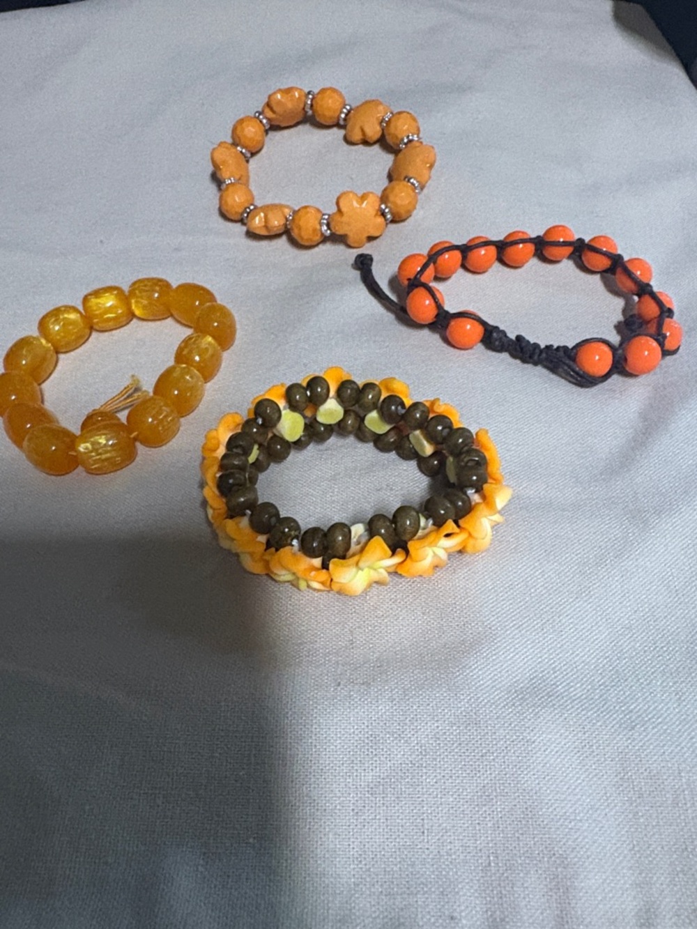 Set of 4 Orange tone Stretch Bracelets